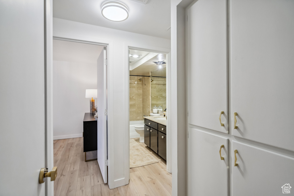 Bathroom featuring vanity and wood finished floors