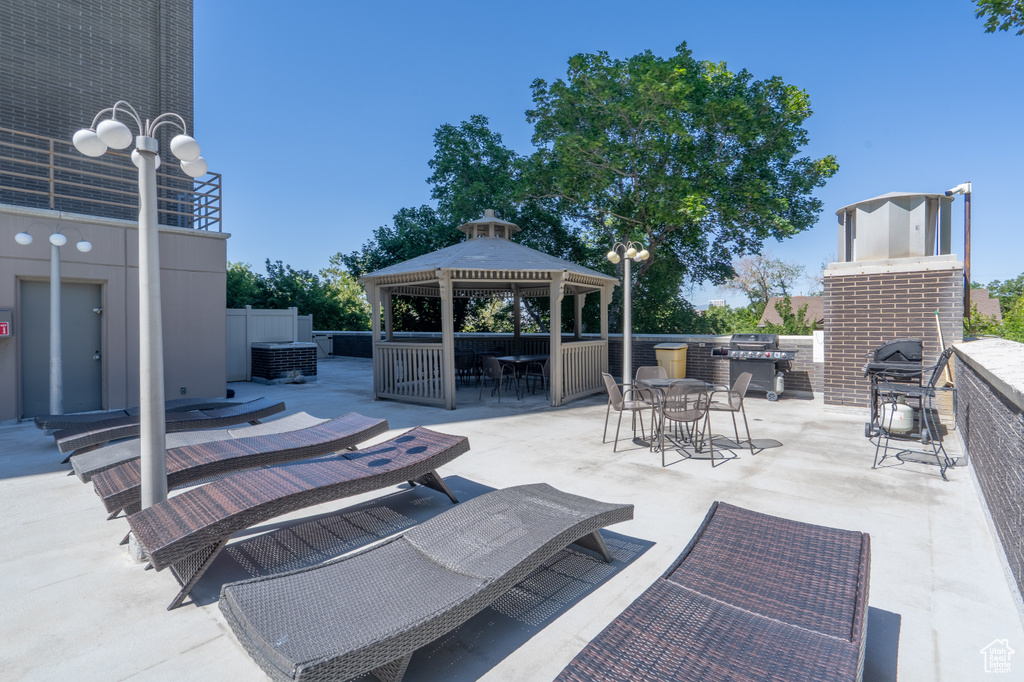 View of patio featuring a gazebo, outdoor dining space, and area for grilling