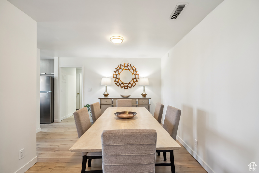 Dining space with light wood-type flooring