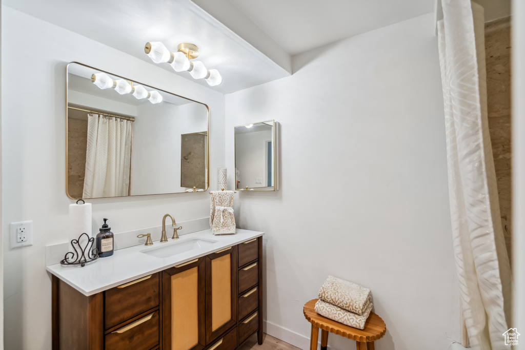 Full bath featuring vanity