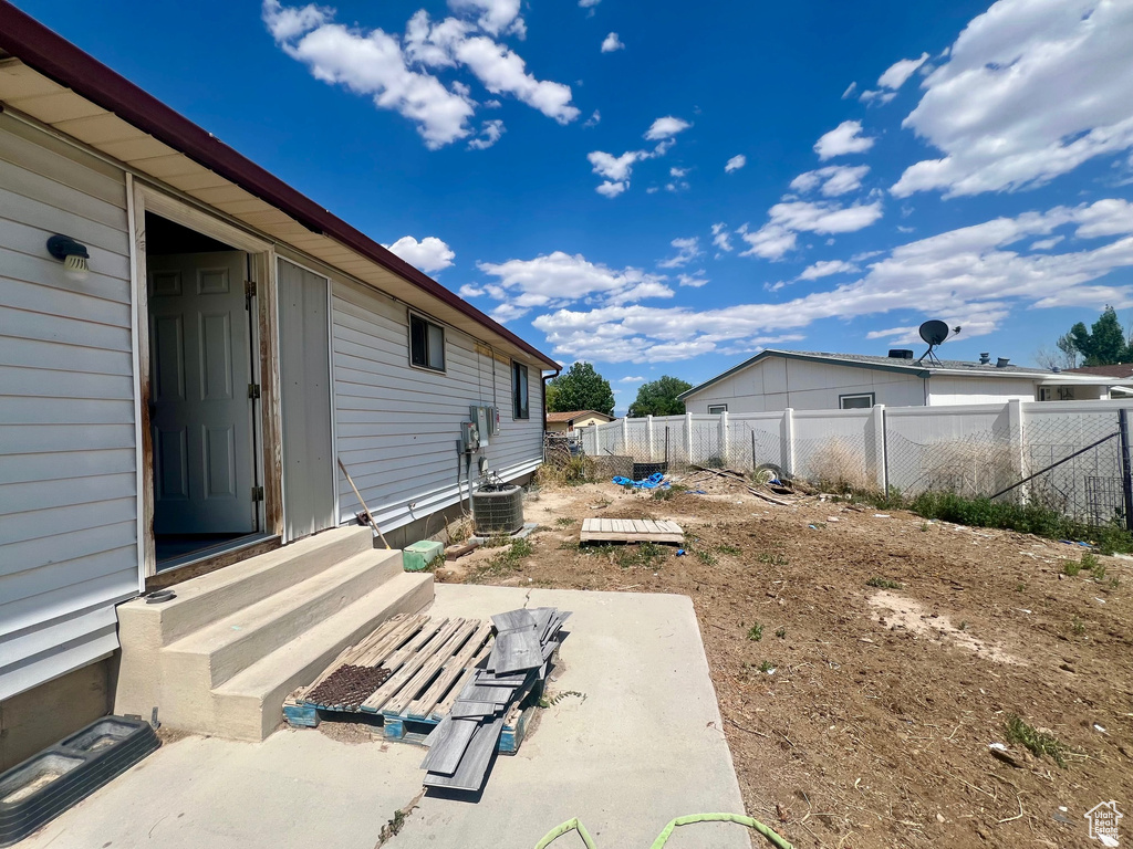 View of yard featuring entry steps