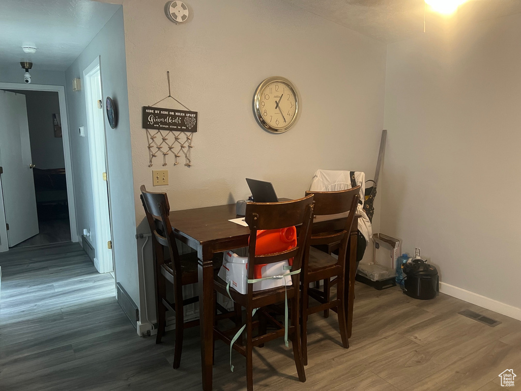 Dining space featuring wood finished floors