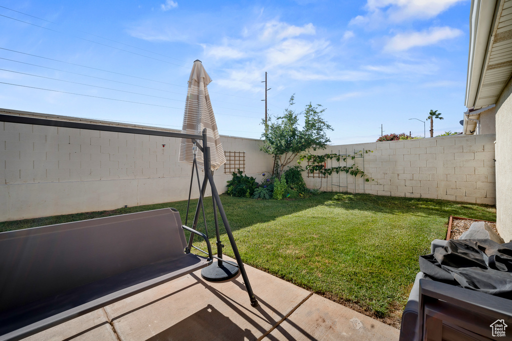 Fenced backyard featuring a patio