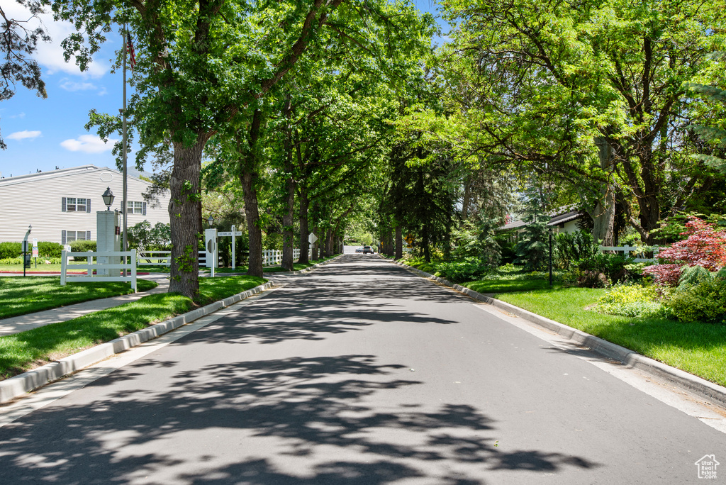 View of asphalt street featuring curbs