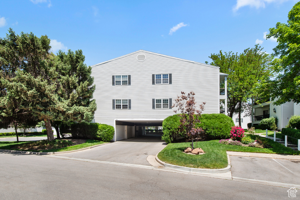 View of property with driveway