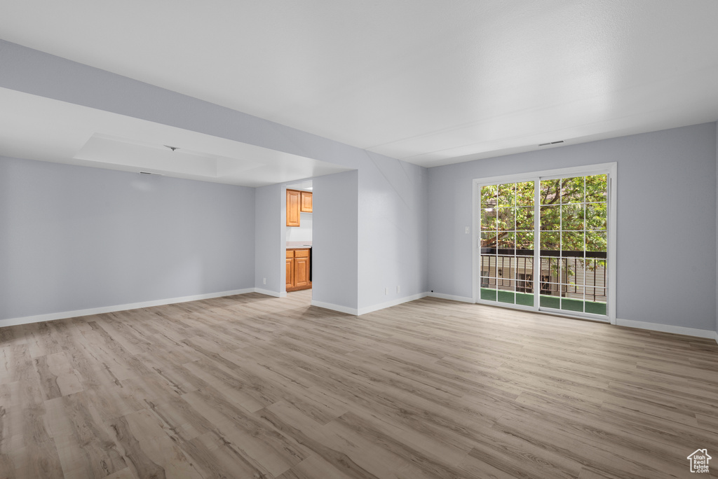 Empty room featuring light wood-style flooring and baseboards