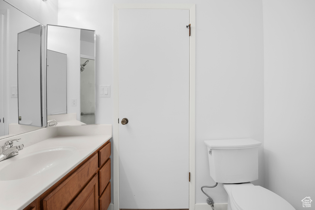 Bathroom with toilet and vanity