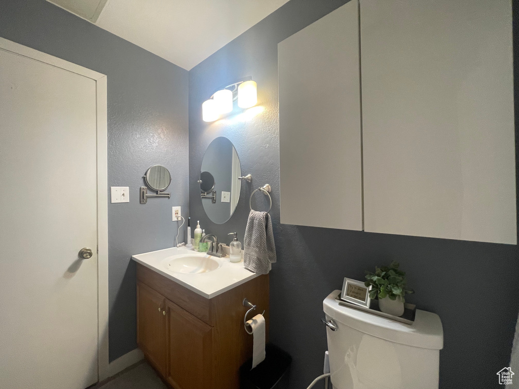 Bathroom featuring vanity and toilet