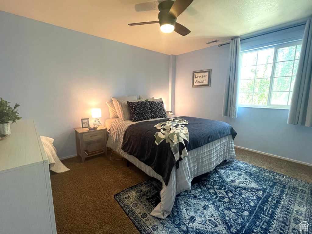 Bedroom featuring carpet flooring and ceiling fan