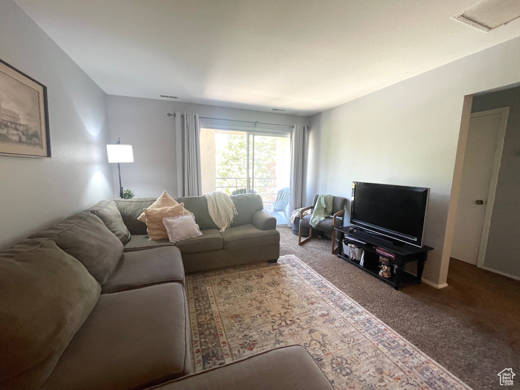 Living area with carpet flooring