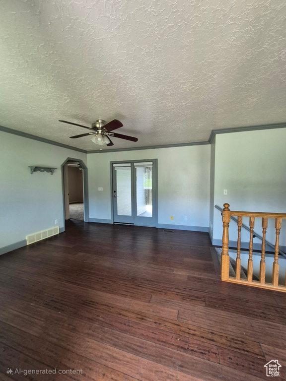Unfurnished room featuring hardwood / wood-style flooring, ceiling fan, arched walkways, a textured ceiling, and crown molding