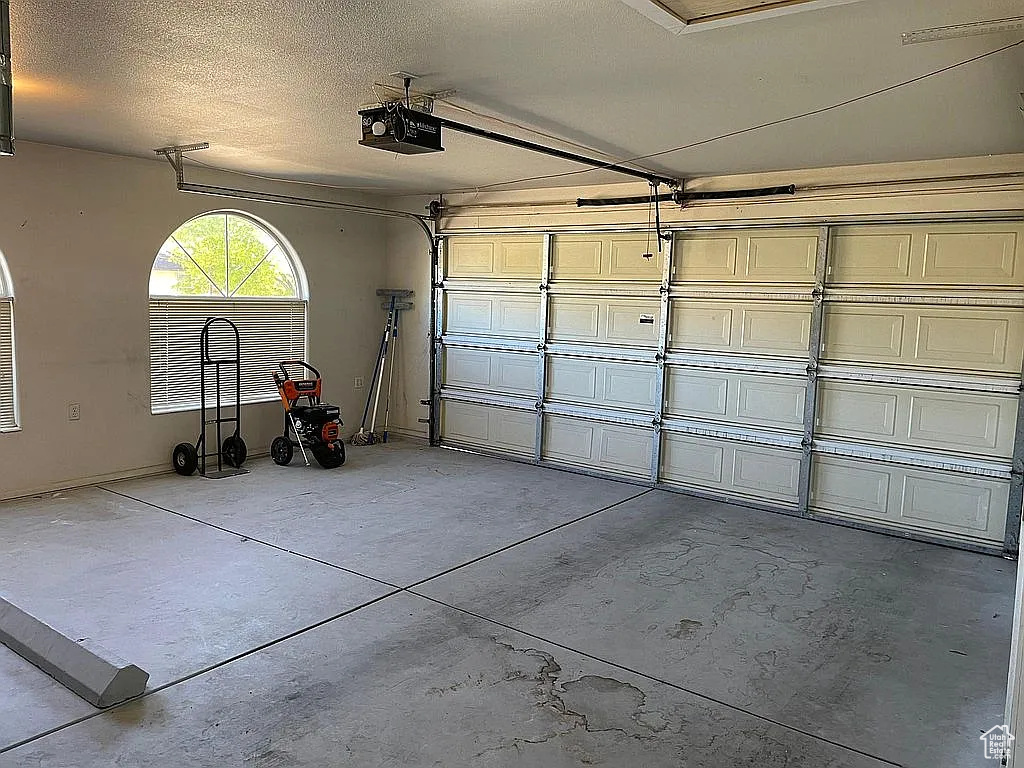 Garage featuring a garage door opener
