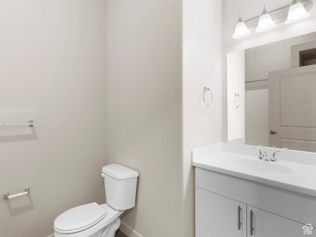 Bathroom featuring baseboards and vanity