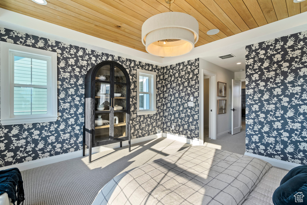 Bedroom with wood ceiling, carpet floors, and recessed lighting