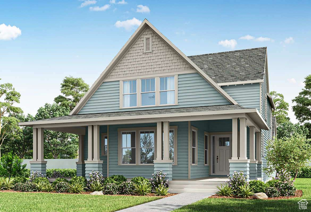 View of front of home with covered porch, a shingled roof, and a front lawn