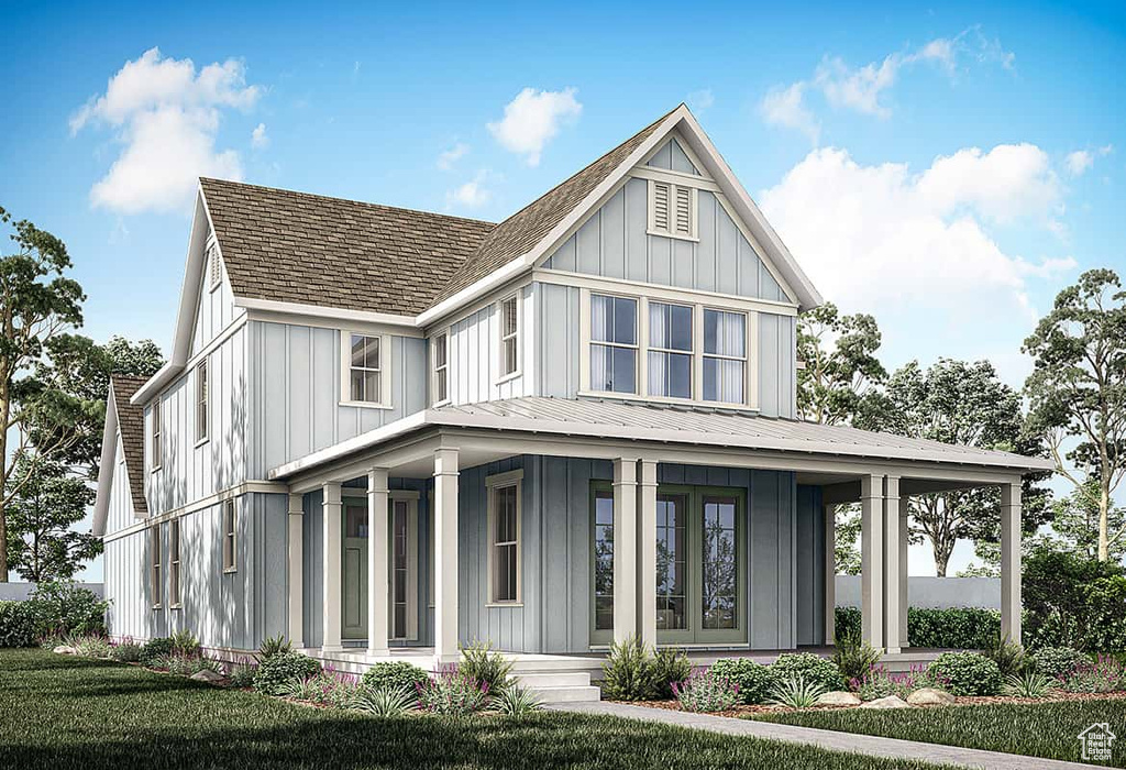 View of front of home featuring a porch, board and batten siding, and a metal roof