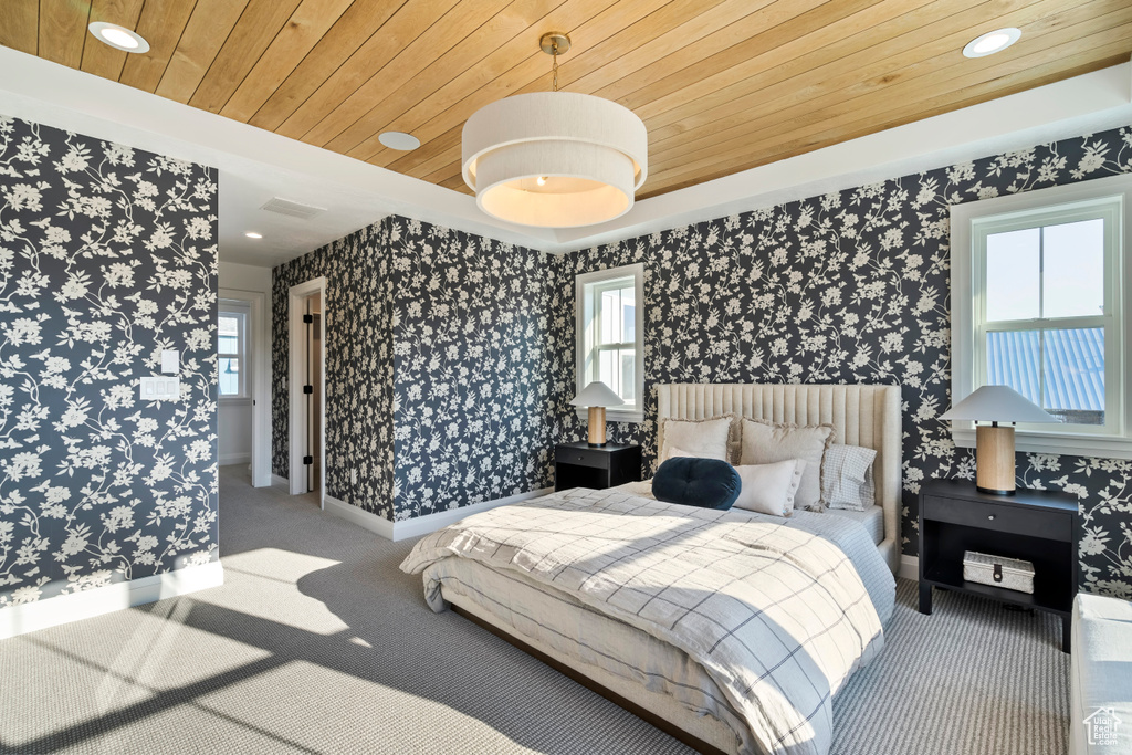 Bedroom featuring wooden ceiling, carpet flooring, recessed lighting, and wallpapered walls