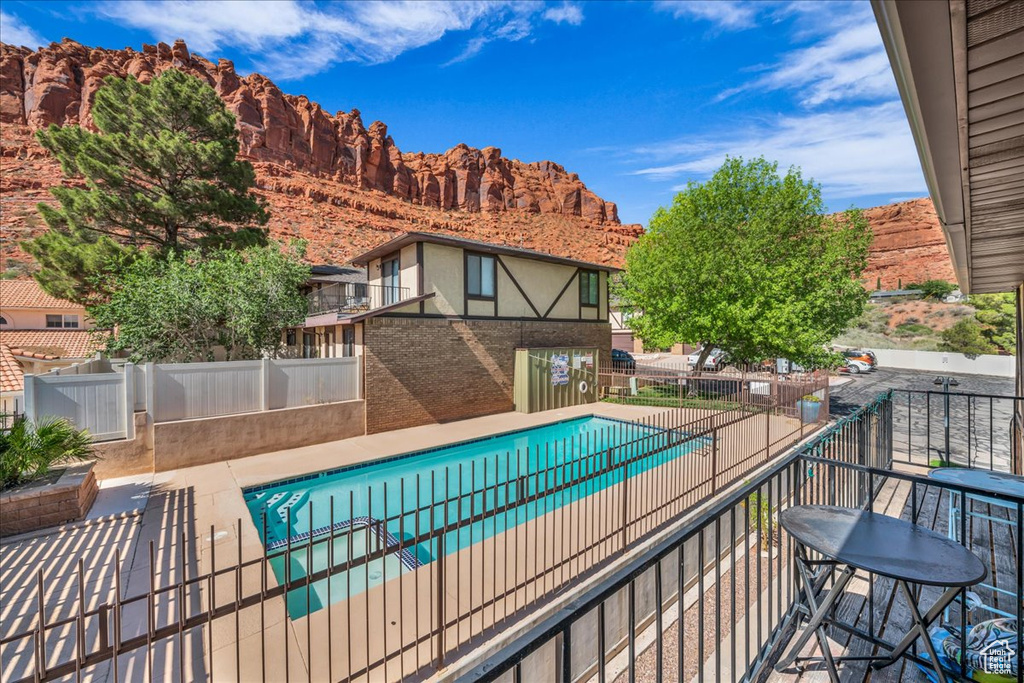 Community pool with a mountain view