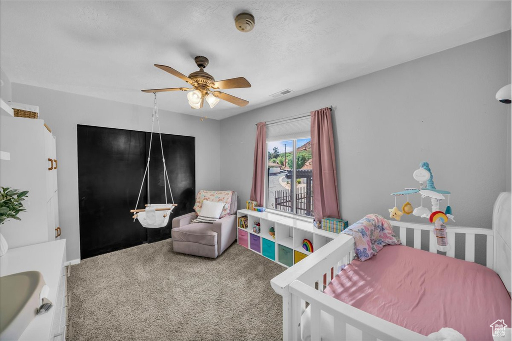 Bedroom featuring carpet floors and a ceiling fan