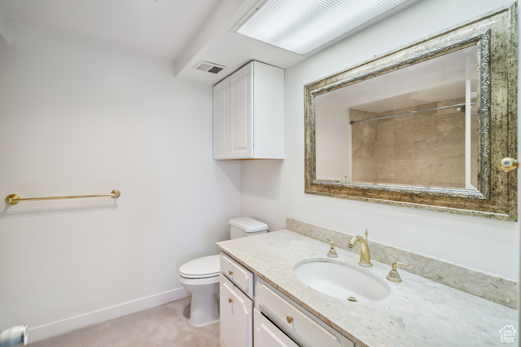 Bathroom with vanity and a shower