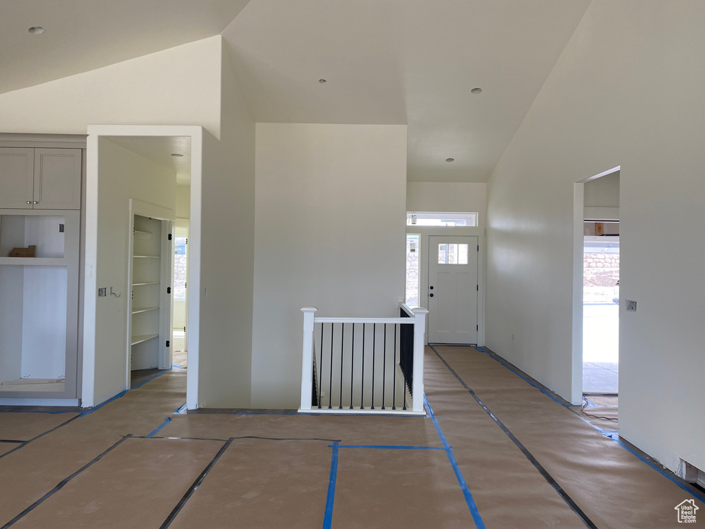 Foyer with high vaulted ceiling