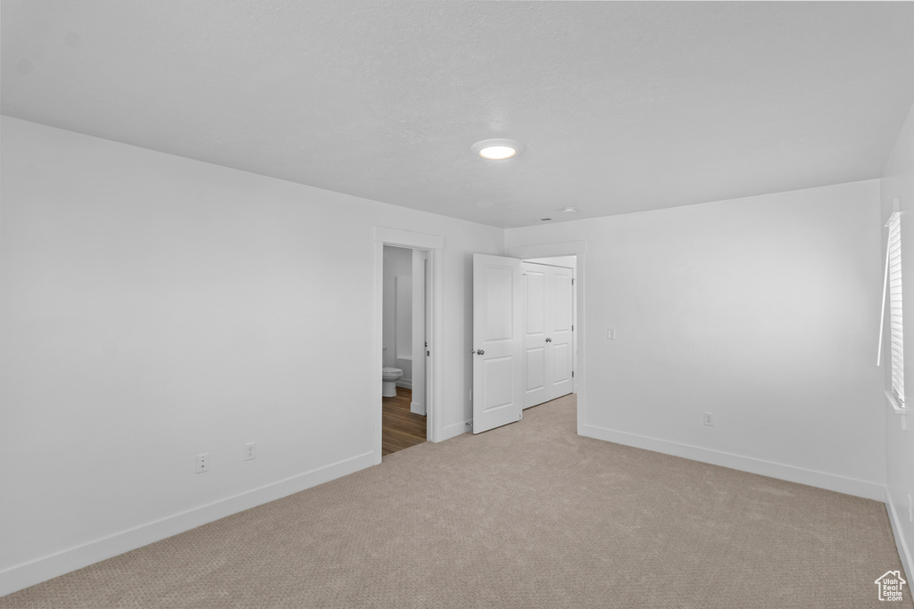 Unfurnished room featuring light colored carpet and recessed lighting