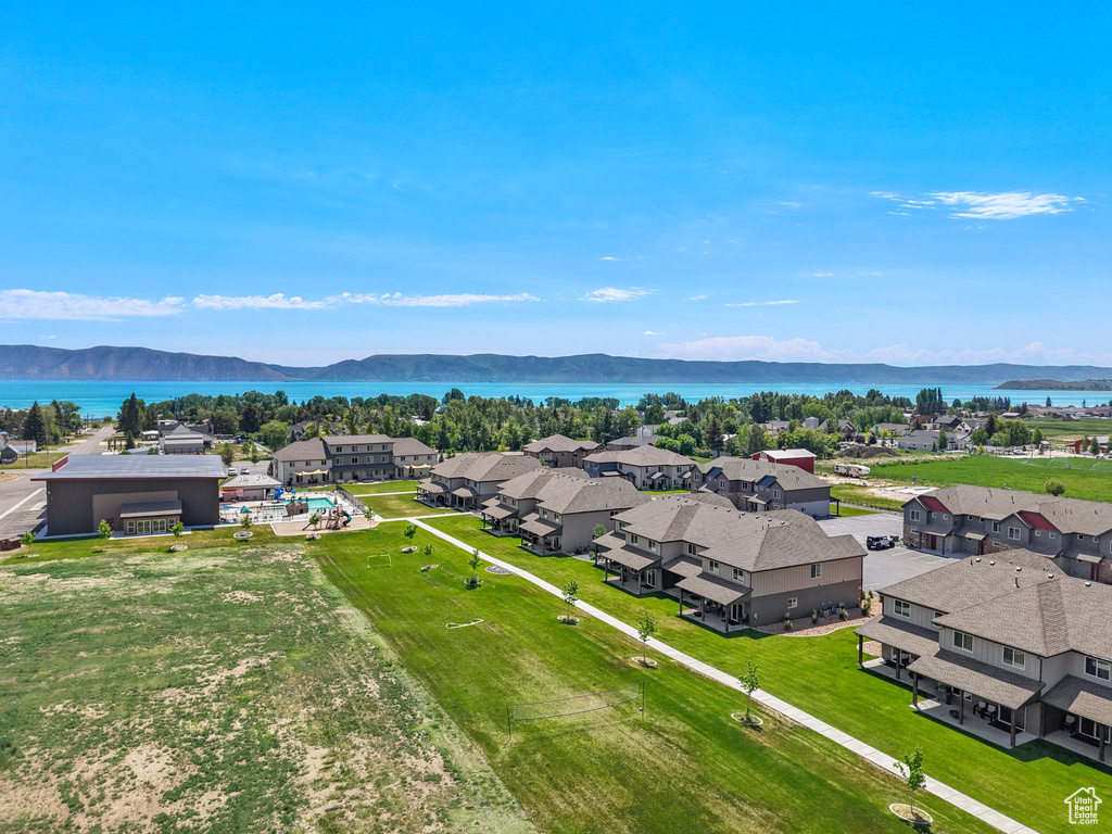 Aerial view of residential area featuring a water and mountain view