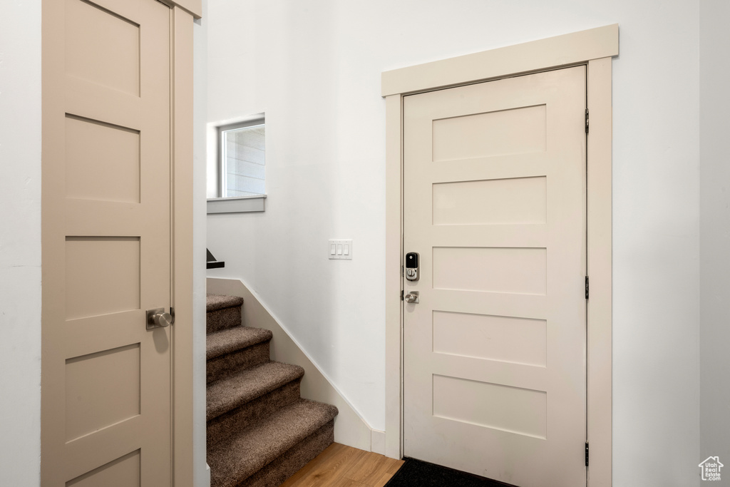Foyer entrance with stairs and light wood finished floors