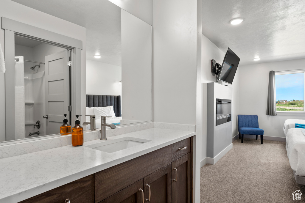 Full bath featuring ensuite bathroom and vanity