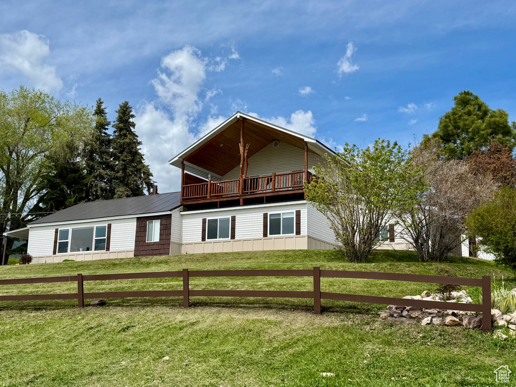 Back of property with metal roof