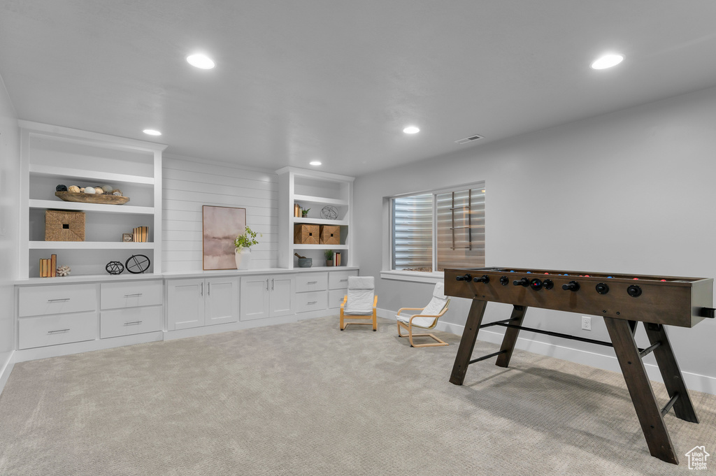 Recreation room featuring carpet flooring and recessed lighting