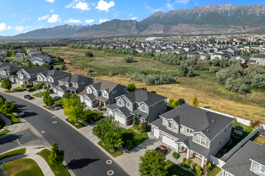 Aerial perspective of suburban area featuring a mountainous background