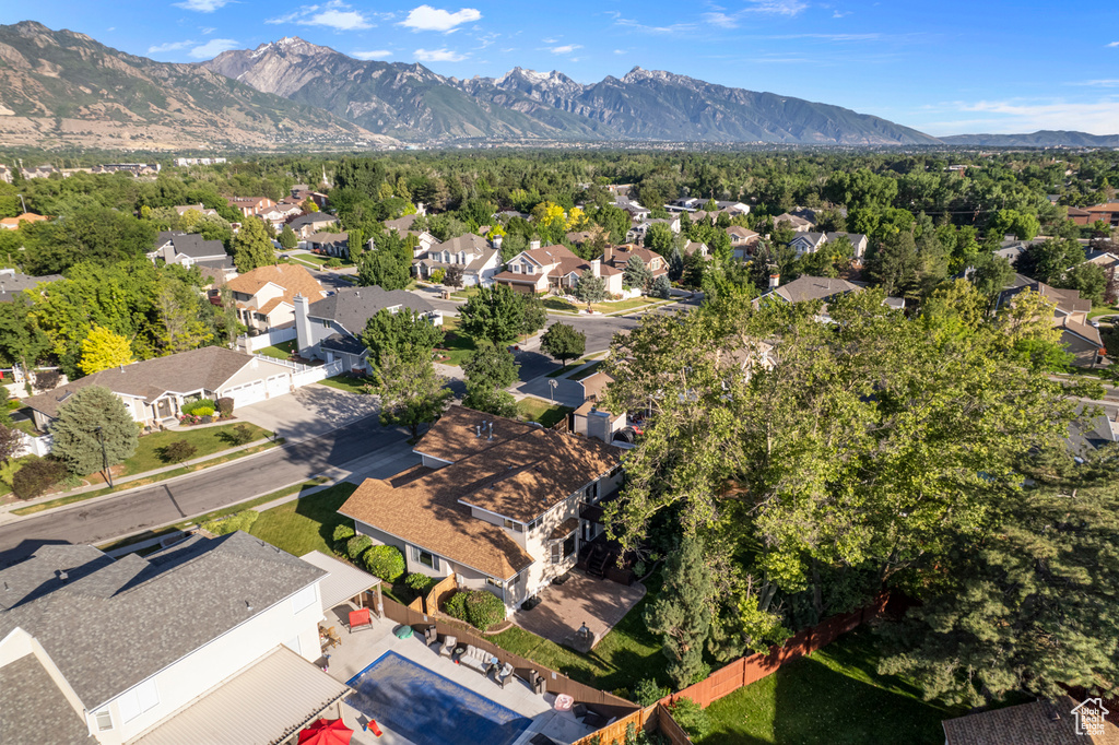 Aerial view of residential area featuring a mountain backdrop