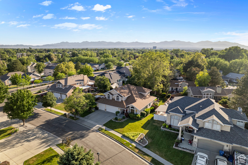 Aerial view of residential area featuring a mountain backdrop