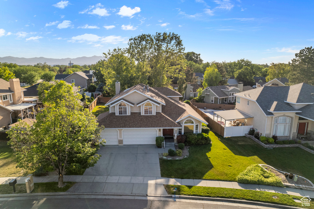 Aerial view of residential area with a mountain backdrop
