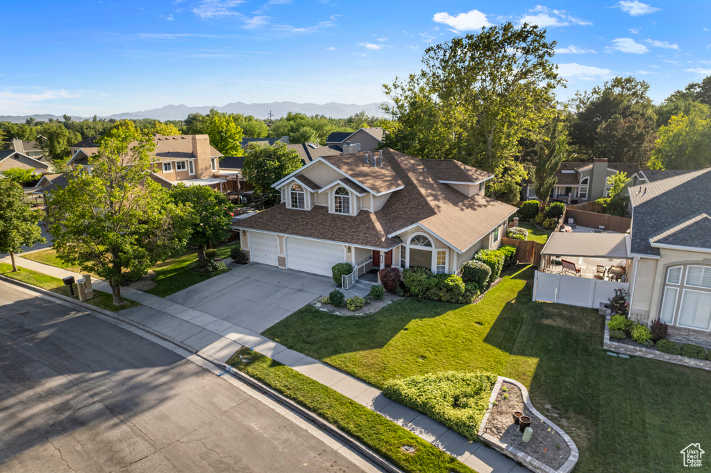 Aerial perspective of suburban area featuring a mountain backdrop