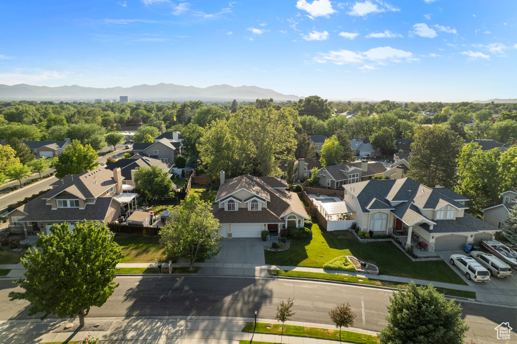 Aerial perspective of suburban area with a mountain backdrop