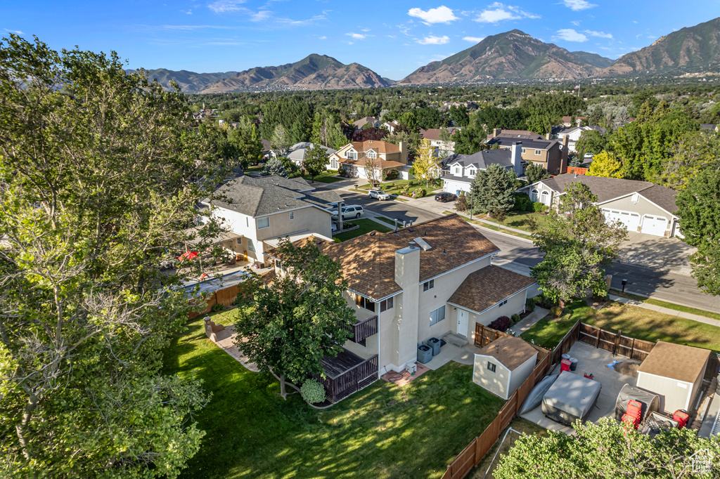 Aerial view of residential area featuring mountains
