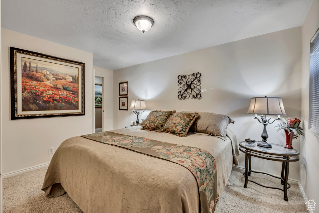 Bedroom featuring carpet flooring