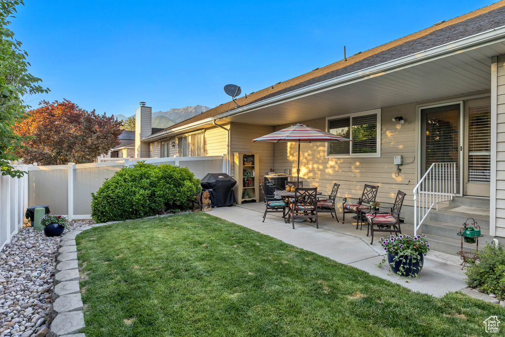 Fenced backyard with a patio