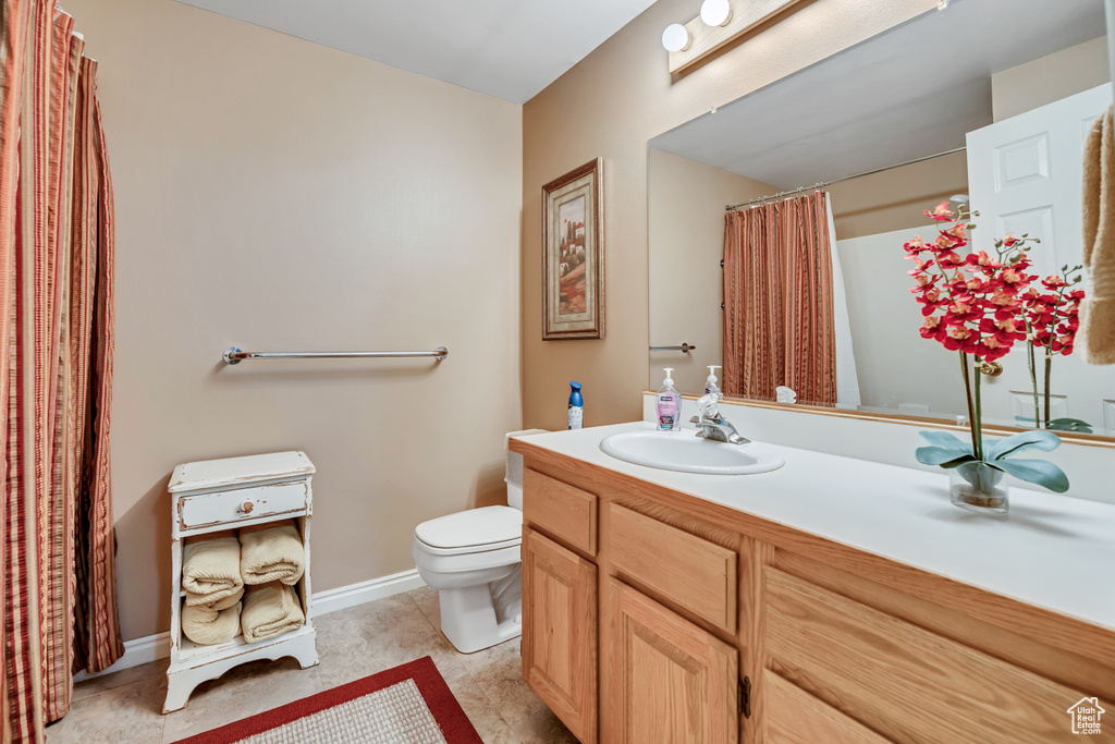 Full bathroom with vanity and a shower with curtain