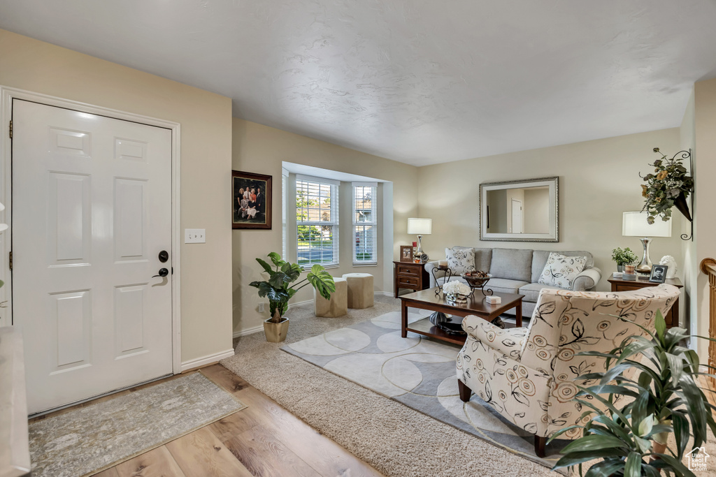 Living room with baseboards and wood finished floors