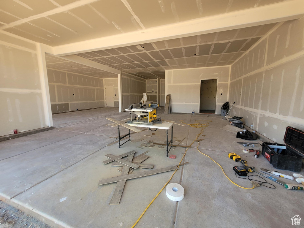 Misc room featuring a garage and concrete flooring