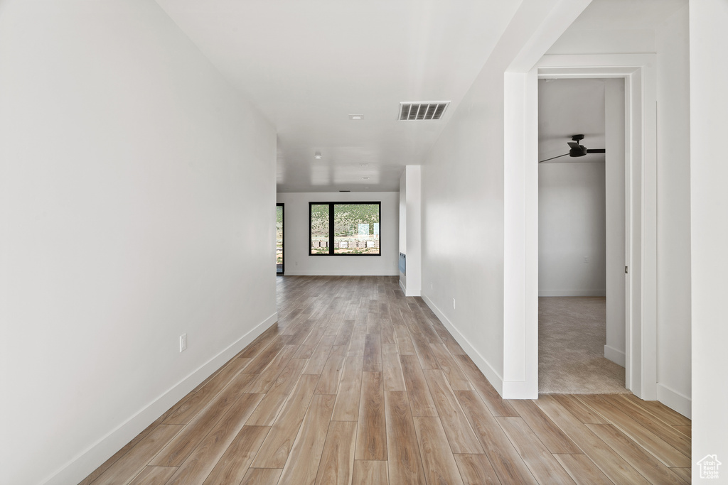 Corridor with light wood-style floors