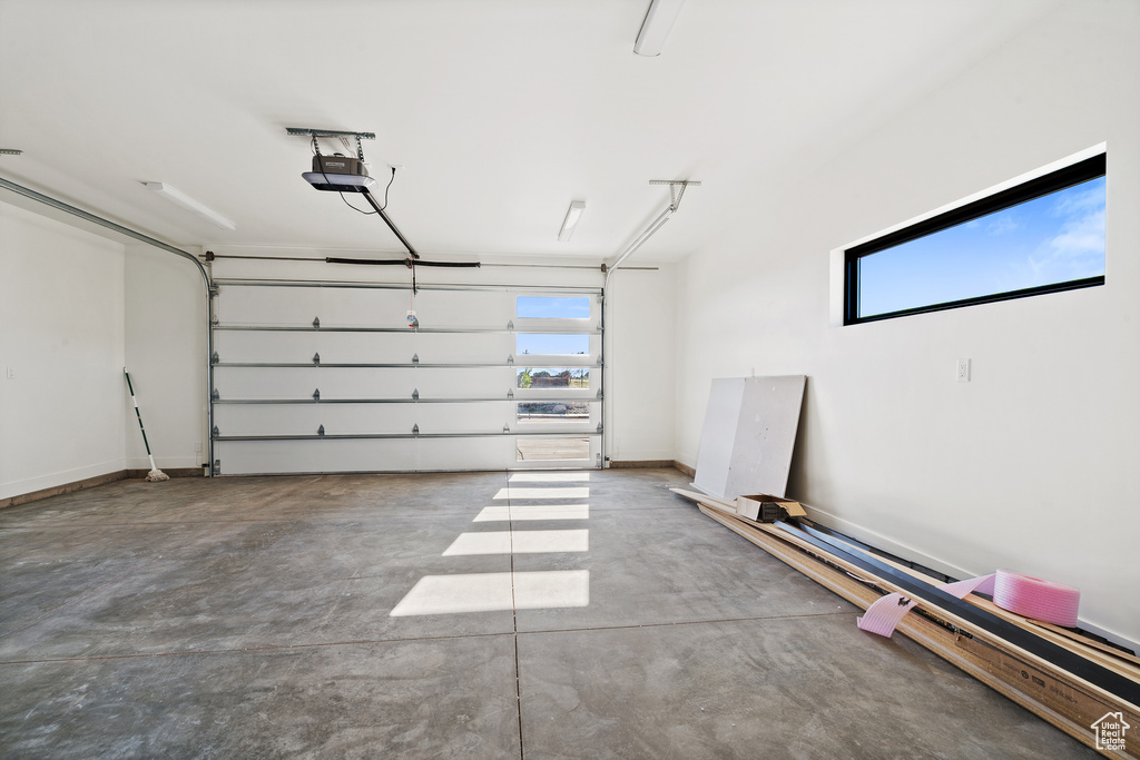Garage featuring a garage door opener