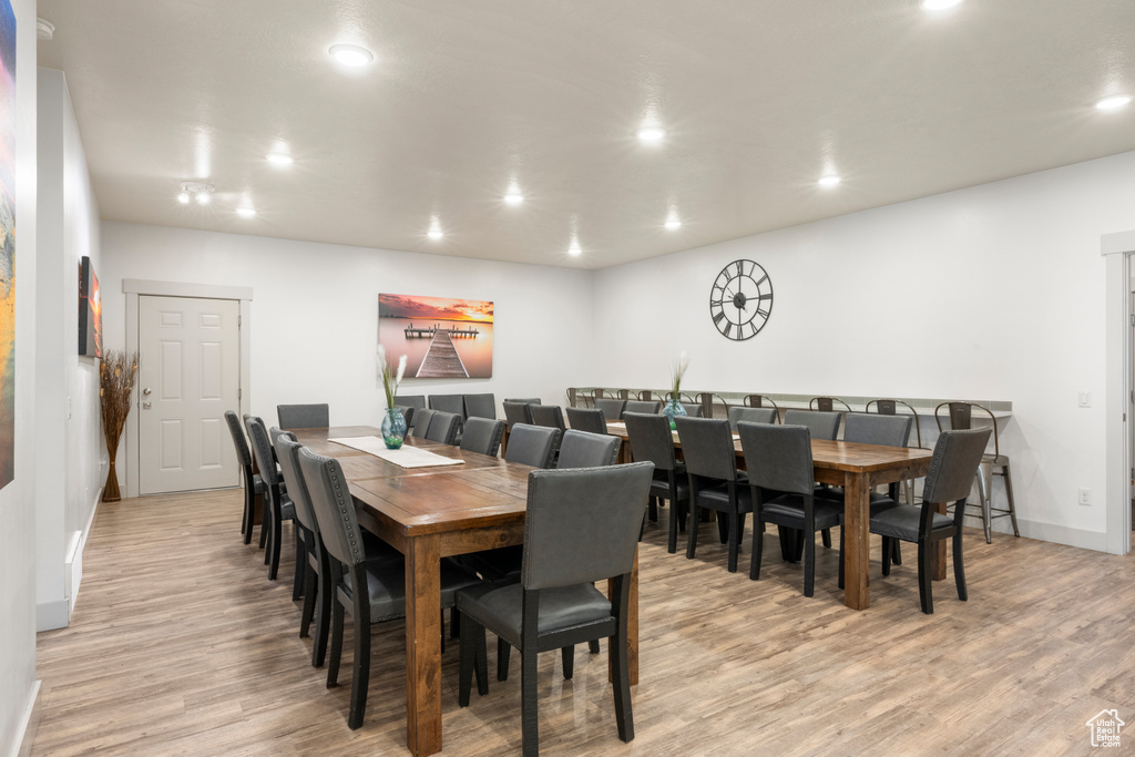Dining room featuring light wood-style floors and recessed lighting