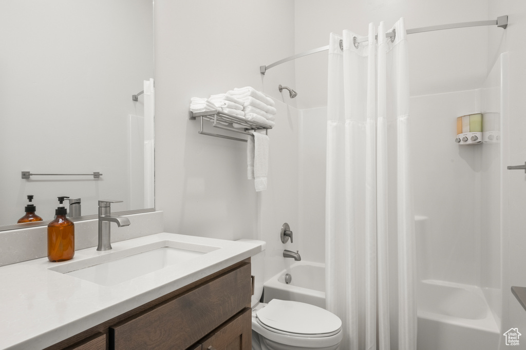 Full bathroom featuring vanity and shower / tub combo with curtain