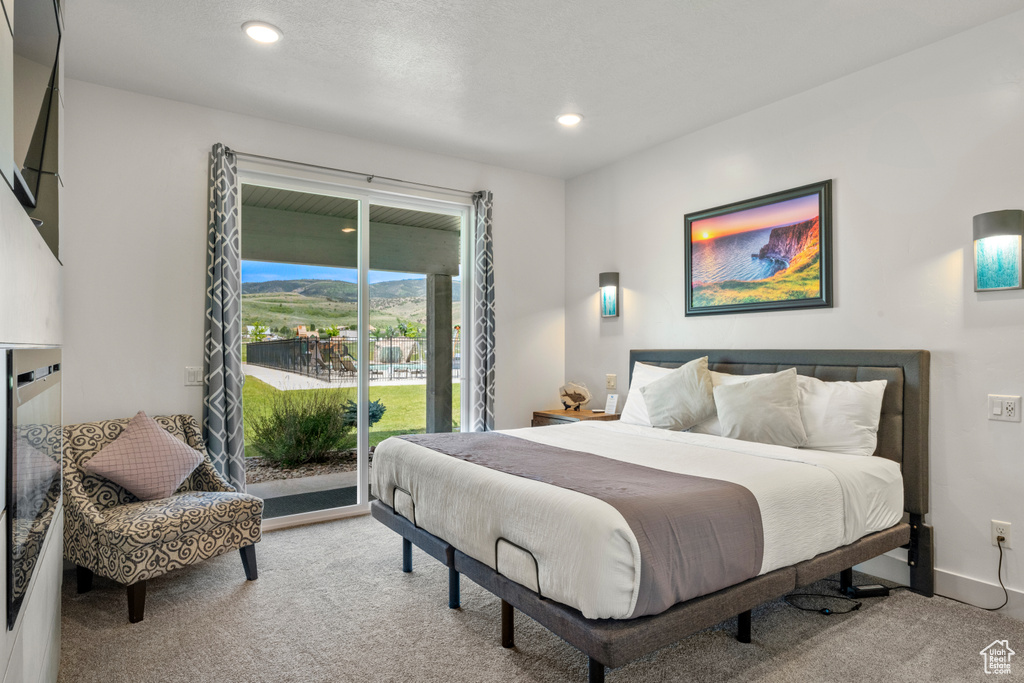 Bedroom featuring carpet flooring, access to outside, and recessed lighting