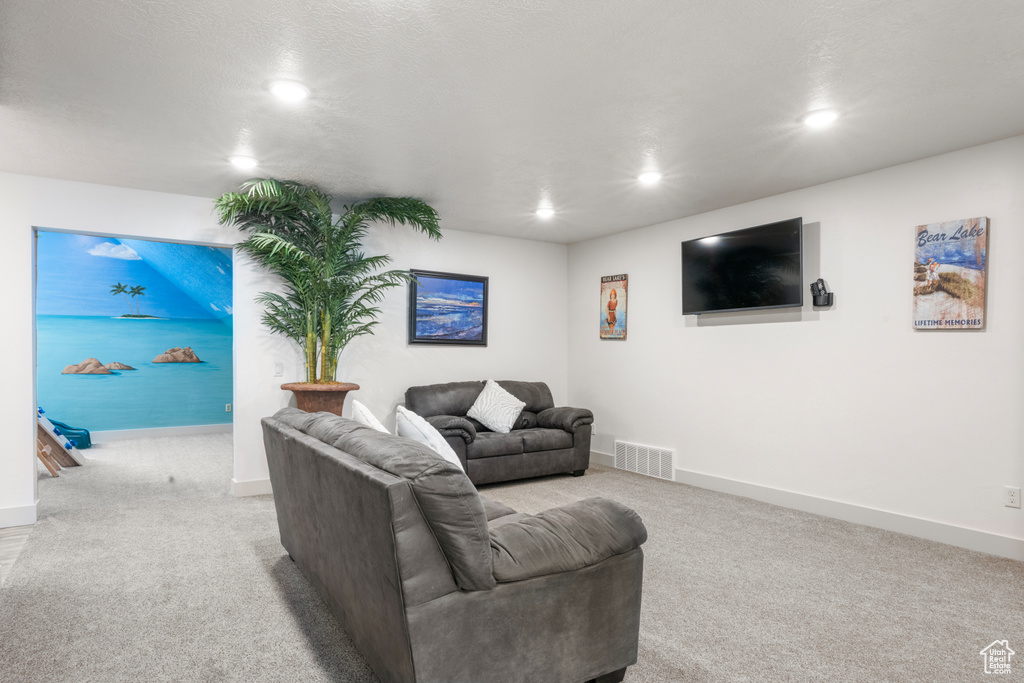 Living room featuring recessed lighting and carpet flooring