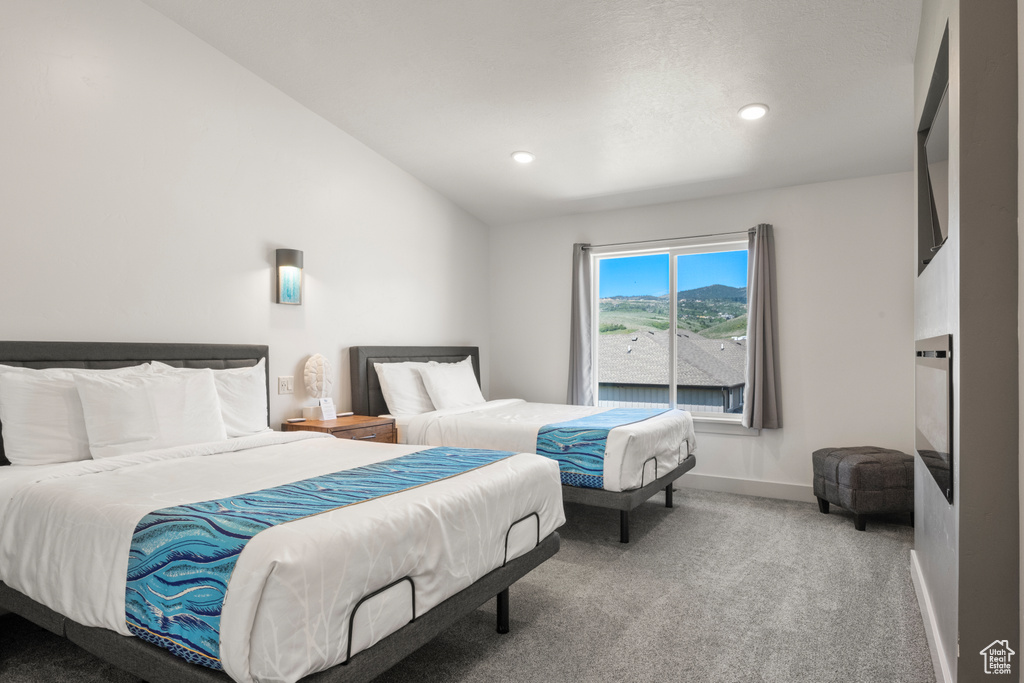 Carpeted bedroom featuring recessed lighting and lofted ceiling